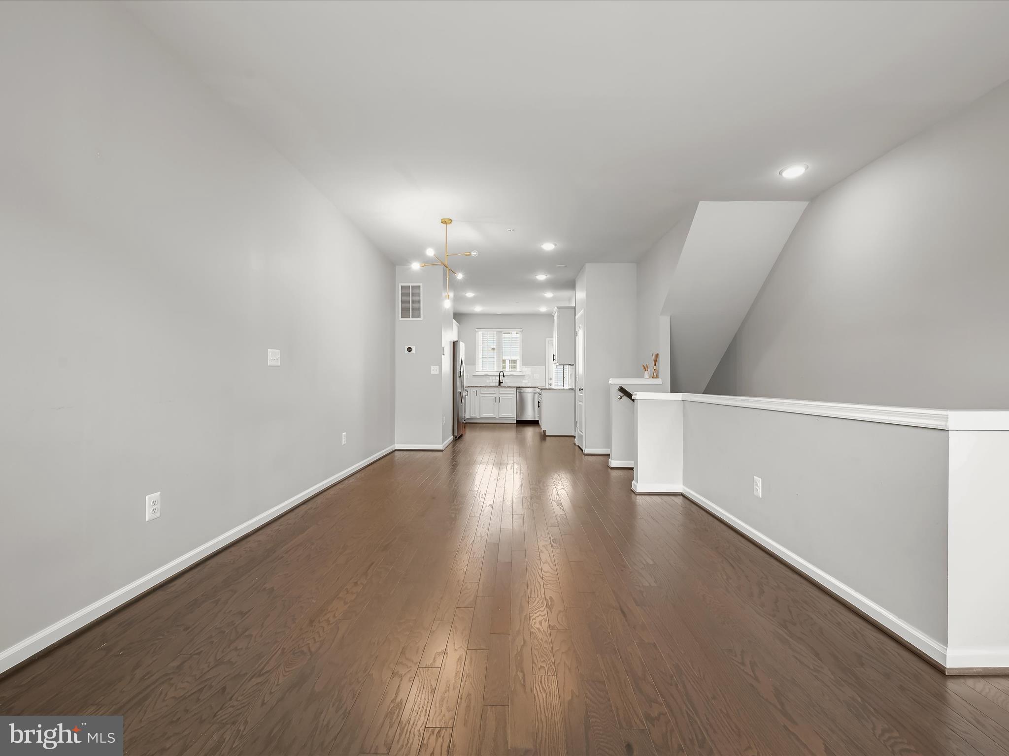 2612 Hardaway Circle Hanover, MD 21076 - Photo 6 of 29 a view of an empty room with wooden floor
