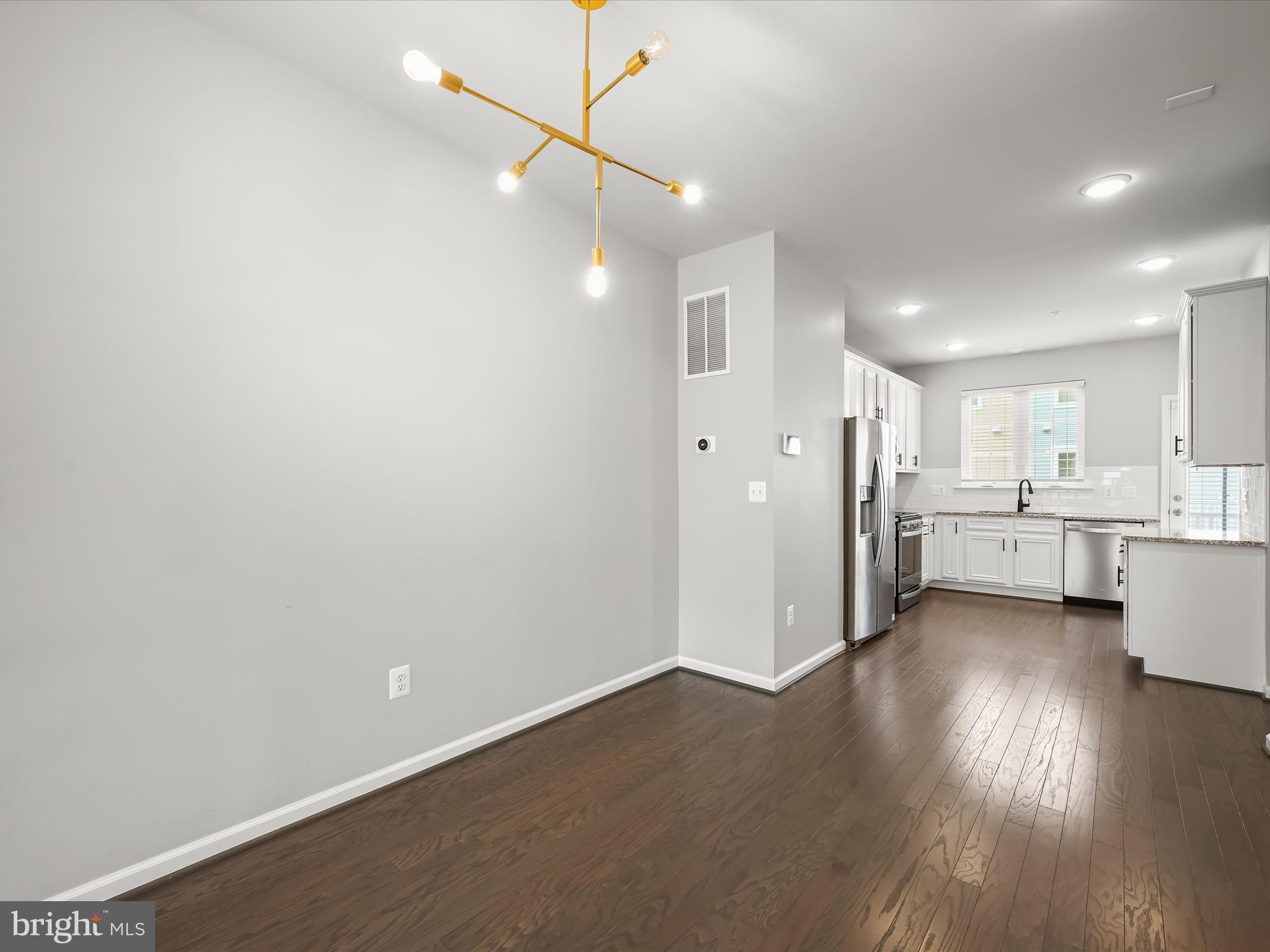 2612 Hardaway Circle Hanover, MD 21076 - Photo 8 of 29 a view of a kitchen with wooden floor and windows