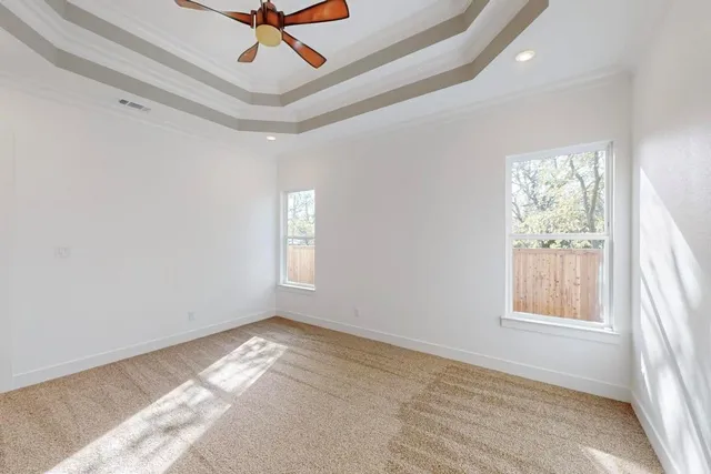 a view of room with window and ceiling fan