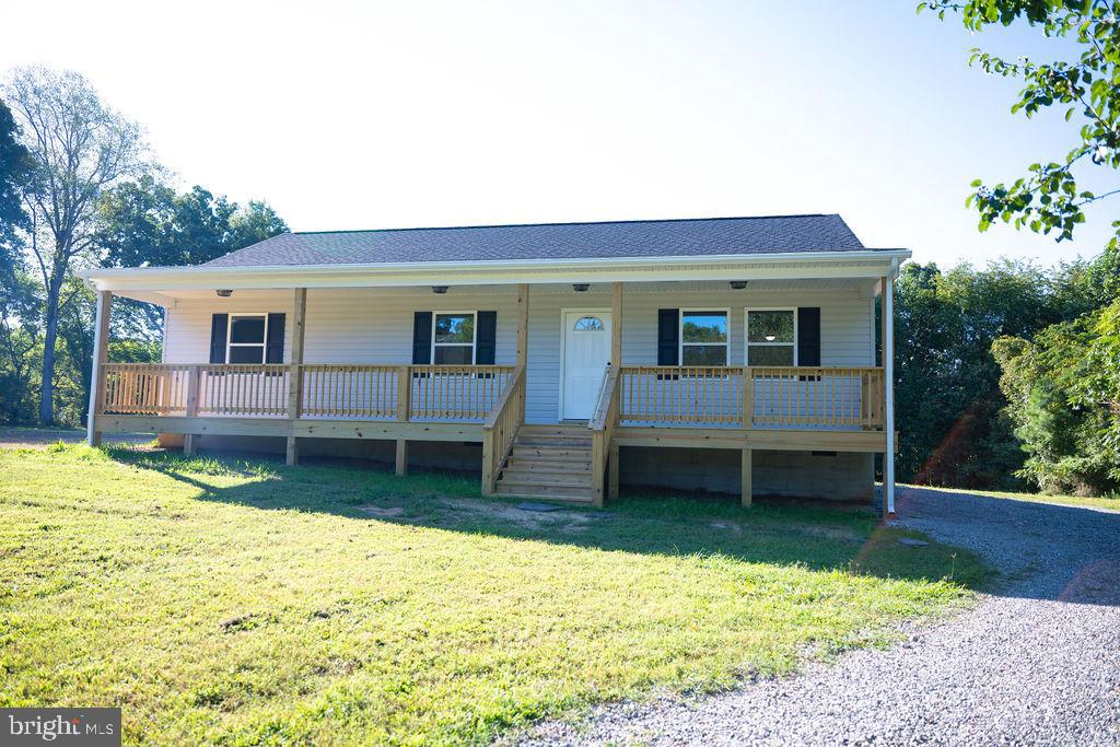 100 Bumpass Road Bumpass, VA 23024 - Photo 4 of 16 a view of a house with a yard