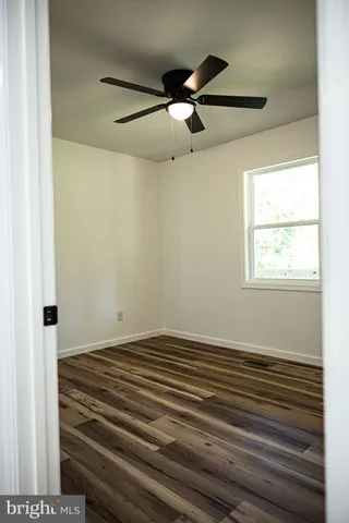 a view of room with window and ceiling fan