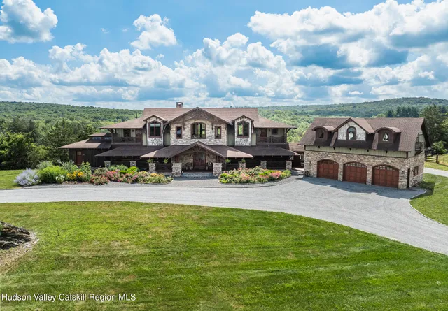 a kitchen with stainless steel appliances granite countertop a refrigerator a stove and a sink