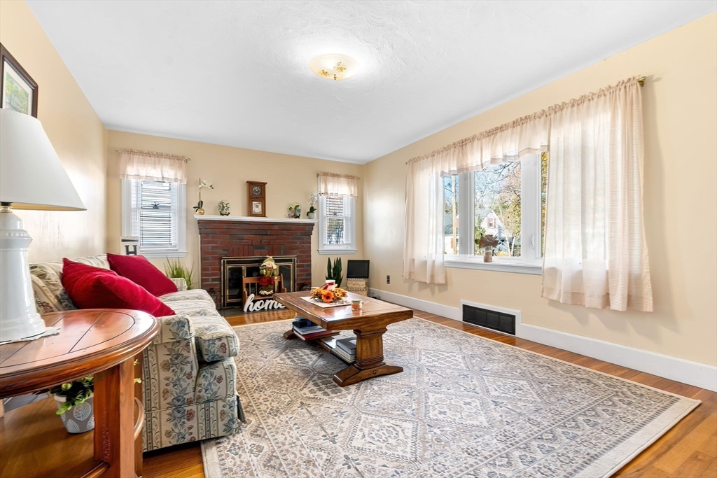 33 Proctor Circle Peabody, MA 01960 - Photo 15 of 42 a living room with furniture and a fireplace