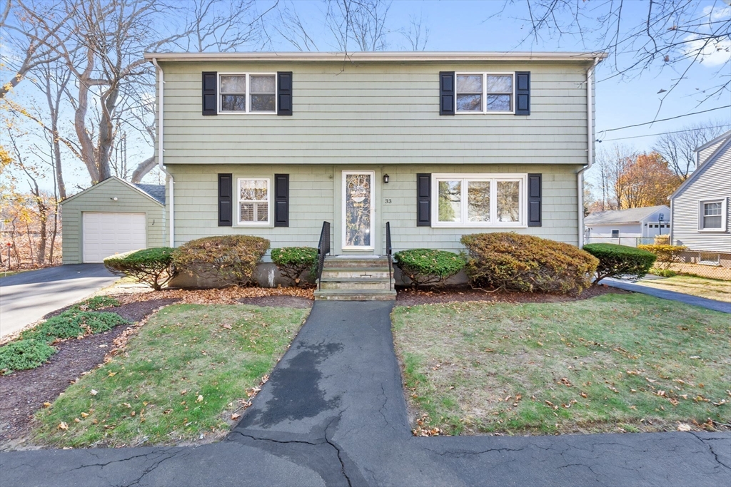 33 Proctor Circle Peabody, MA 01960 - Photo 2 of 42 a front view of a house with a yard