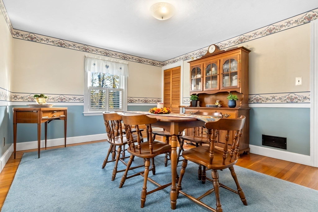 33 Proctor Circle Peabody, MA 01960 - Photo 28 of 42 a dining room with furniture and a floor to ceiling window