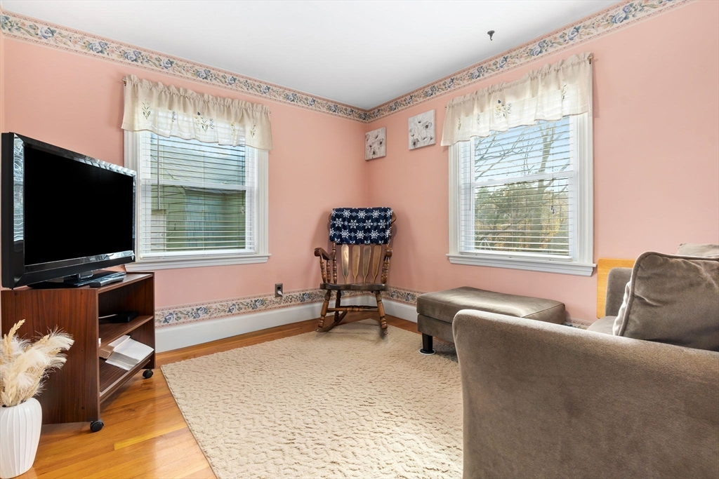 33 Proctor Circle Peabody, MA 01960 - Photo 31 of 42 a living room with furniture and a flat screen tv