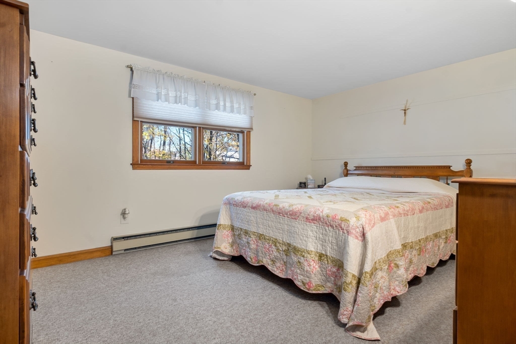 33 Proctor Circle Peabody, MA 01960 - Photo 32 of 42 a bedroom with a bed and a window