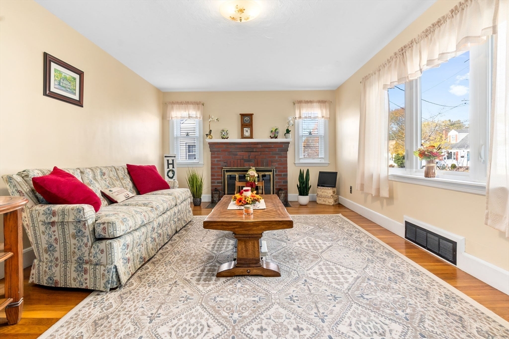 33 Proctor Circle Peabody, MA 01960 - Photo 7 of 42 a living room with furniture and a fireplace