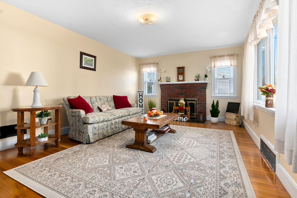 33 Proctor Circle Peabody, MA 01960 - Photo 8 of 42 a living room with furniture and a fireplace