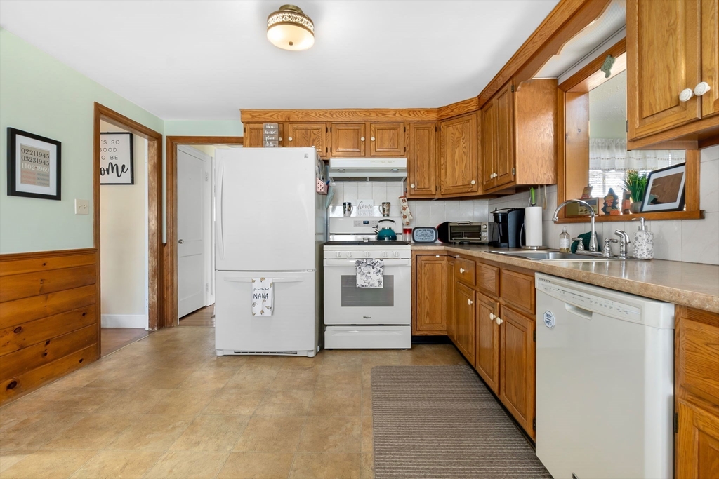 33 Proctor Circle Peabody, MA 01960 - Photo 9 of 42 a kitchen with stainless steel appliances a refrigerator sink and cabinets