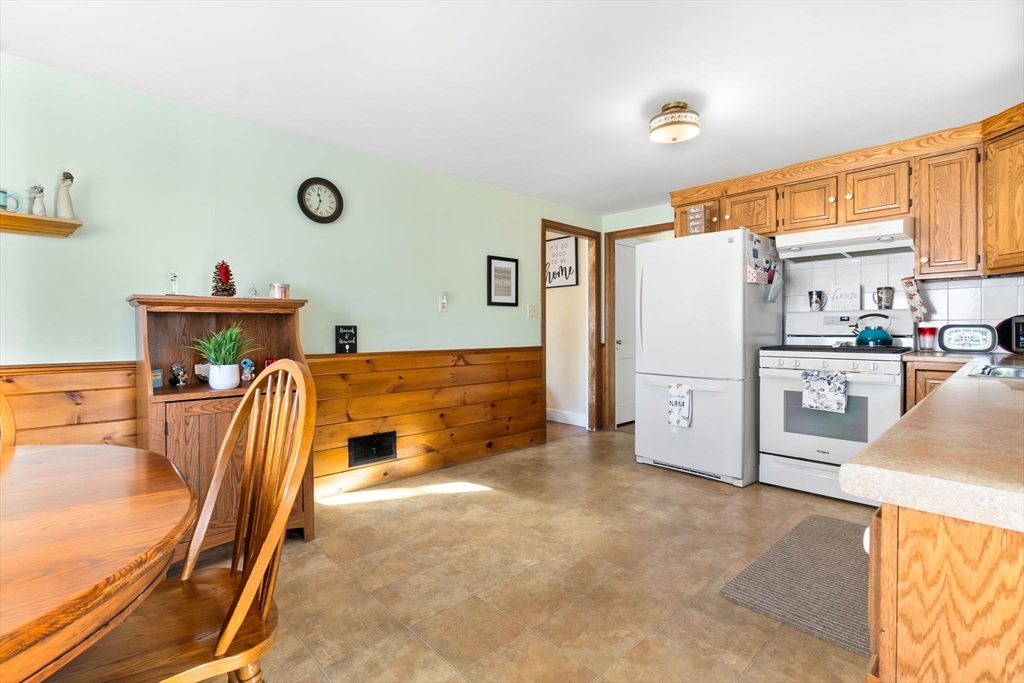 33 Proctor Circle Peabody, MA 01960 - Photo 10 of 42 a kitchen with a refrigerator a sink and a cabinets
