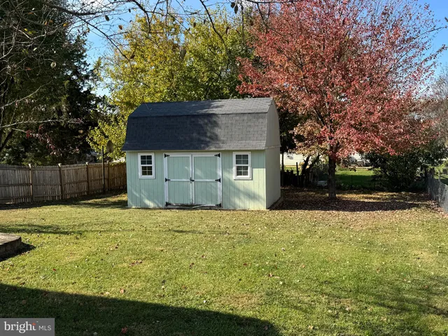a house that has a tree in front of it