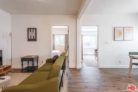 a bedroom with furniture and a window