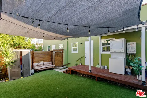 a backyard of a house with seating space