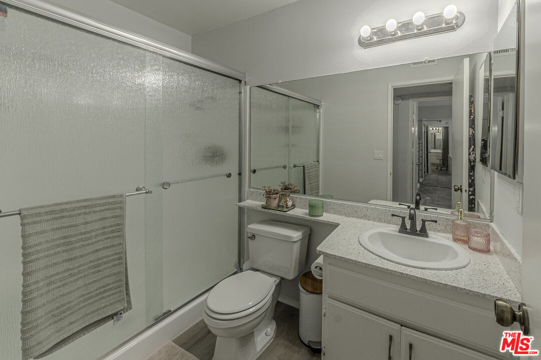 849 East Victoria Street, Unit 101 Carson, CA 90746 - Photo 16 of 19 a bathroom with a sink toilet and shower