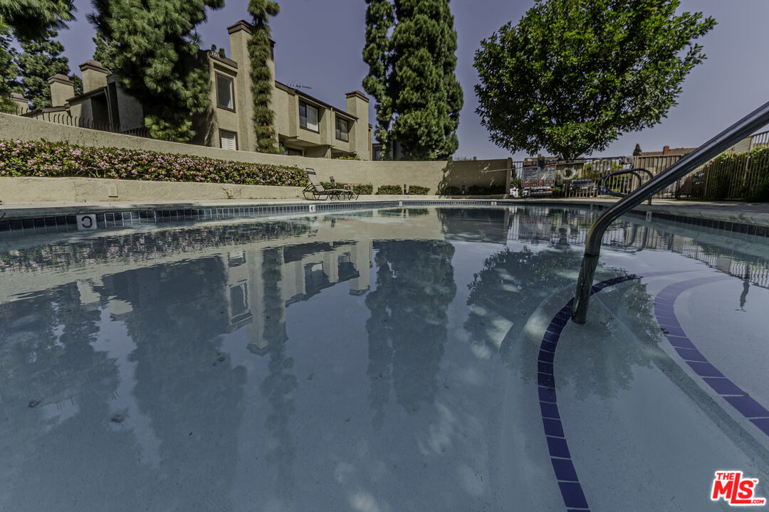 849 East Victoria Street, Unit 101 Carson, CA 90746 - Photo 18 of 19 a view of a swimming pool with a patio