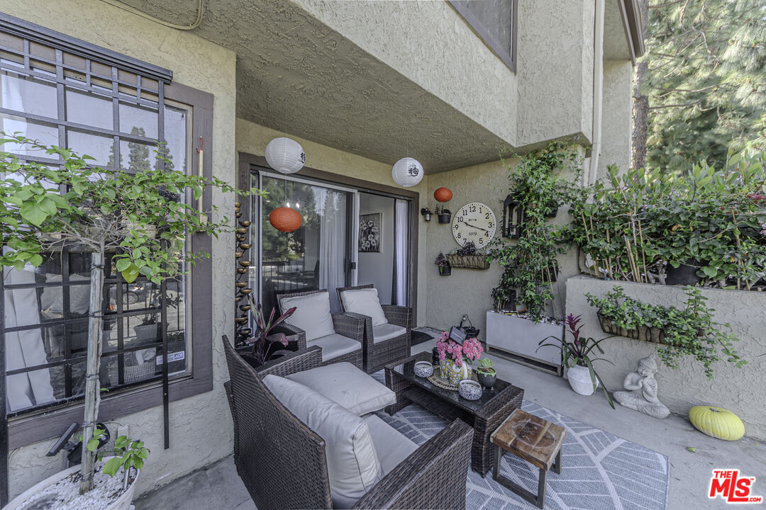 849 East Victoria Street, Unit 101 Carson, CA 90746 - Photo 4 of 19 a view of a patio filled with furniture