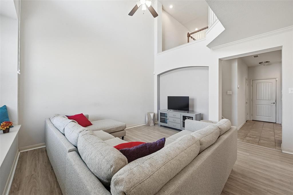 6913 Sandshell Boulevard Fort Worth, TX 76137 - Photo 17 of 24 a living room with furniture and a flat screen tv
