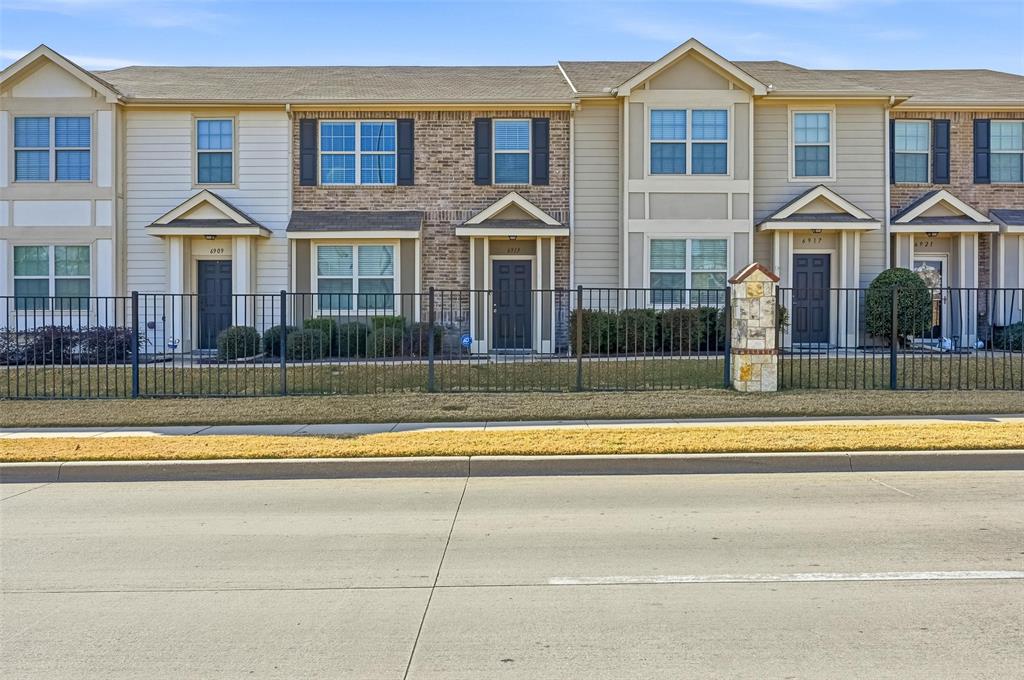 6913 Sandshell Boulevard Fort Worth, TX 76137 - Photo 2 of 24 a view of a white house with a yard and plants