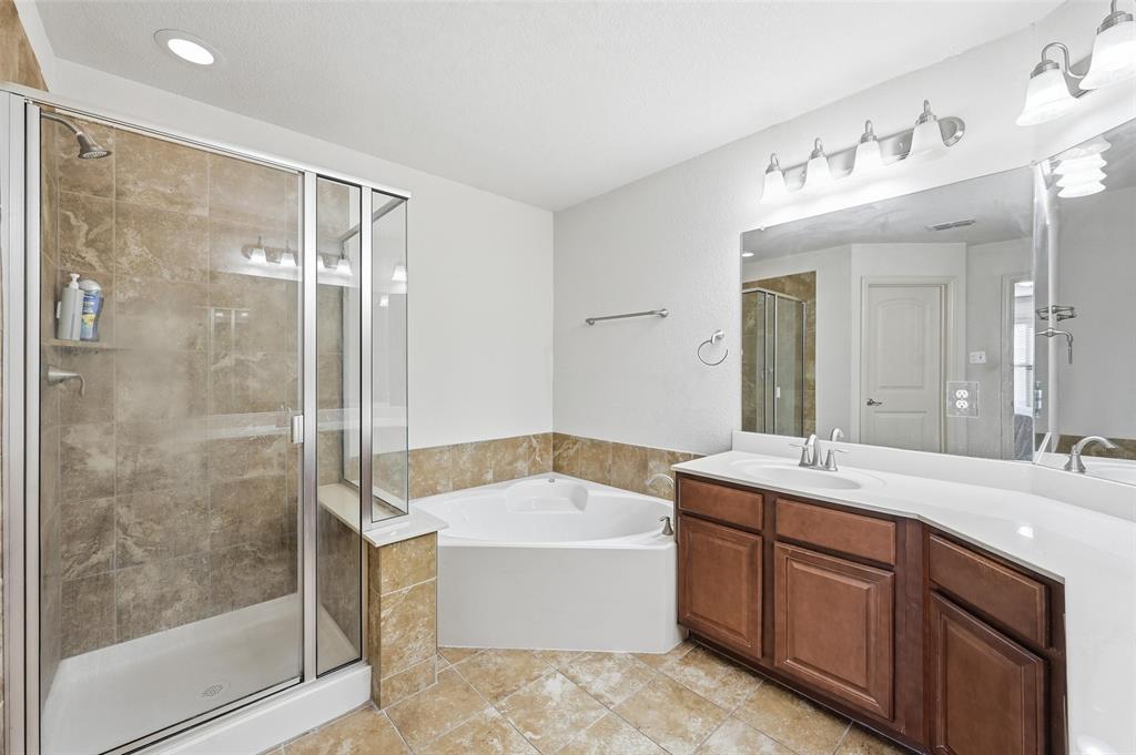 6913 Sandshell Boulevard Fort Worth, TX 76137 - Photo 8 of 24 a bathroom with a bathtub shower sink mirror and toilet