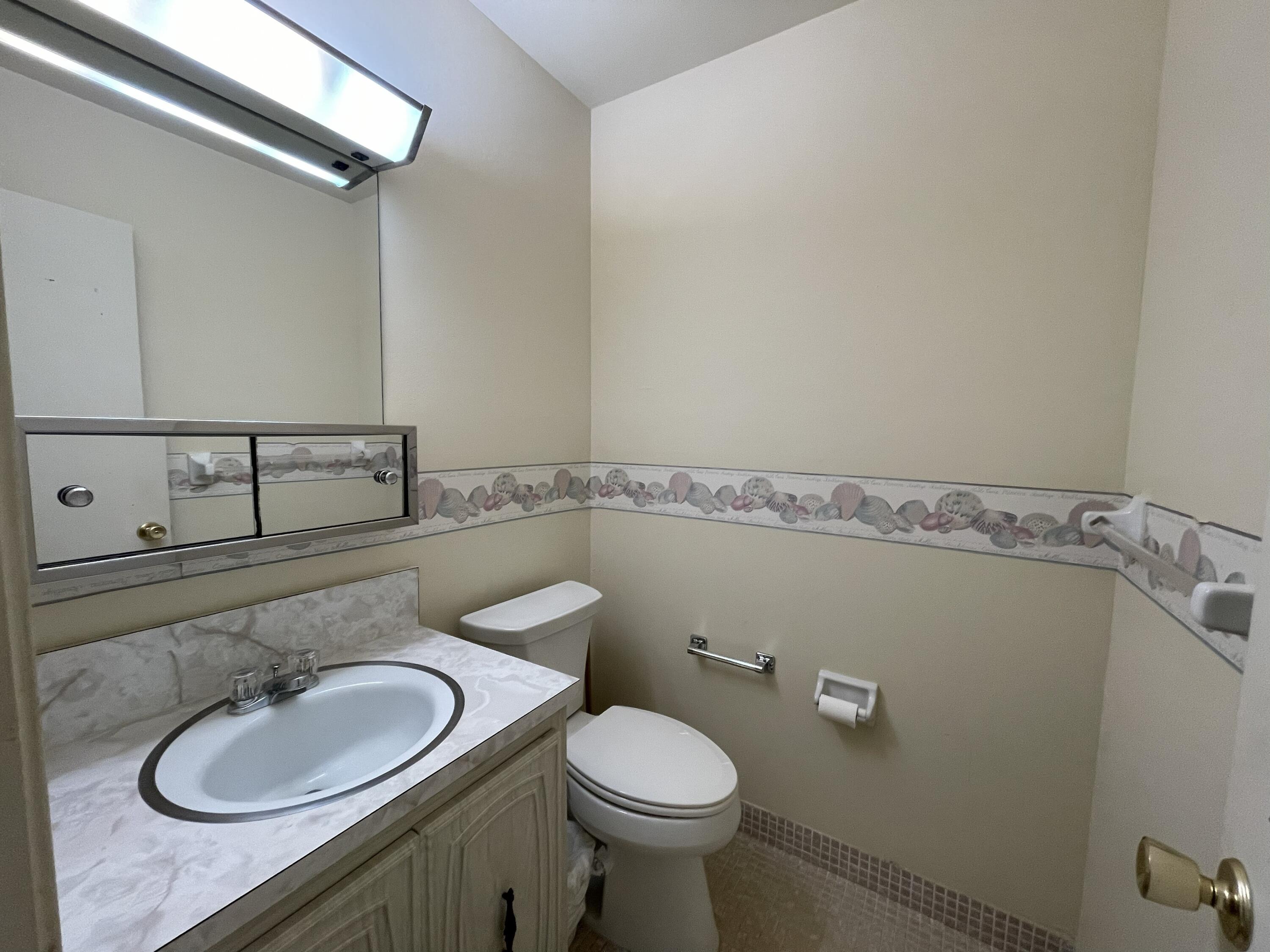 680 High Point Boulevard North, Unit C Delray Beach, FL 33445 - Photo 7 of 26 006_Half Bath