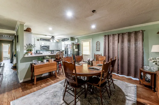 a dining room with furniture and window