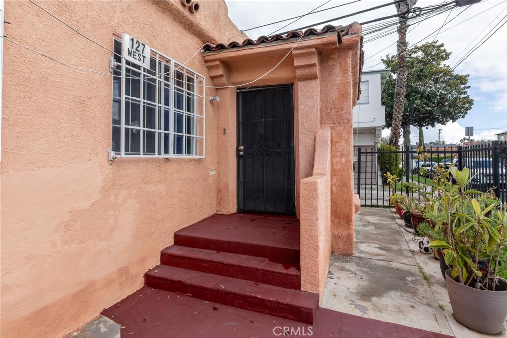 2000 Pacific Long Beach, CA 90806 - Photo 11 of 51 a view of a porch with potted plants