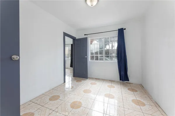 a view of an empty room with windows