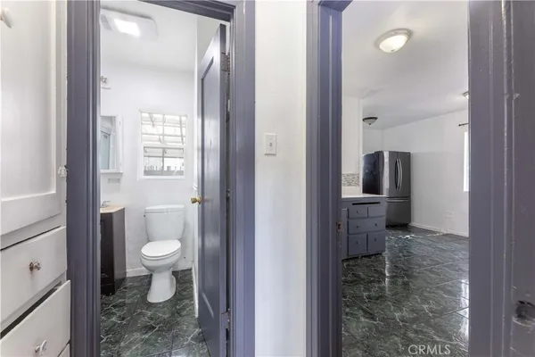 a bathroom with a toilet sink and shower