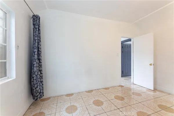 a view of kitchen with refrigerator stove and oven