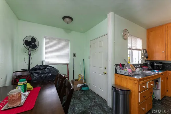 a white toilet sitting next to a bathroom sink