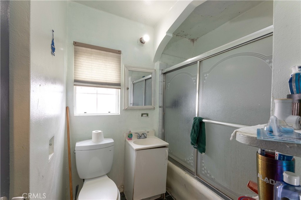 2000 Pacific Long Beach, CA 90806 - Photo 34 of 51 a white toilet sitting next to a bathroom sink