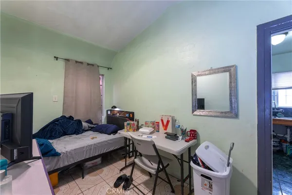 a view of garage with wooden fence