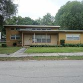 a front view of house with garage and yard