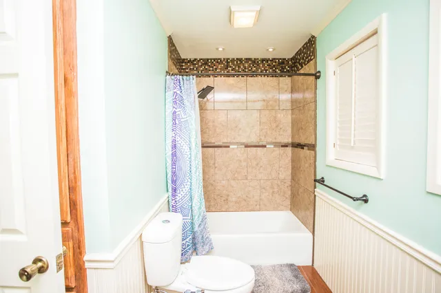 a bathroom with a shower and a toilet