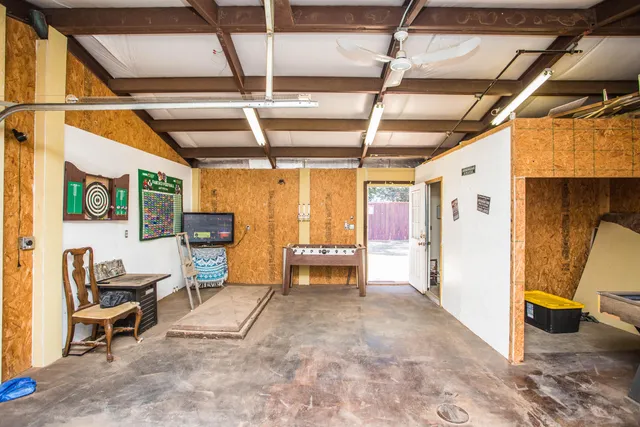 a view of living room with furniture and a window