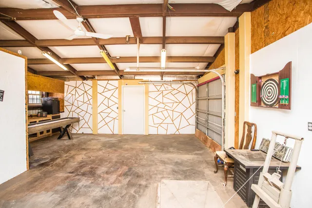 a view of an empty room and a window