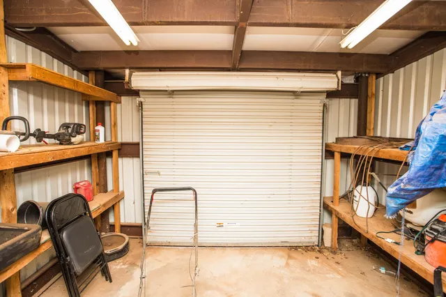 a view of a porch with furniture and a gate