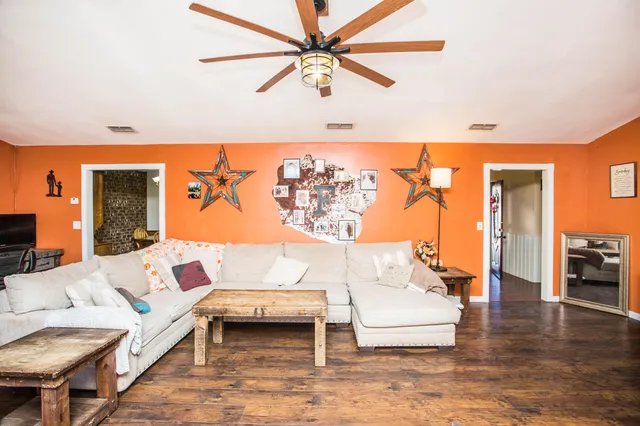a living room with furniture and a table
