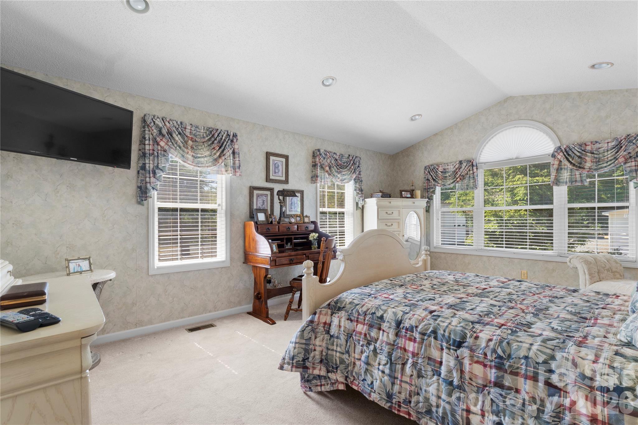 1687 Sexton Road, Unit 5 Denton, NC 27239 - Photo 23 of 48 a large bedroom with a bed and large window