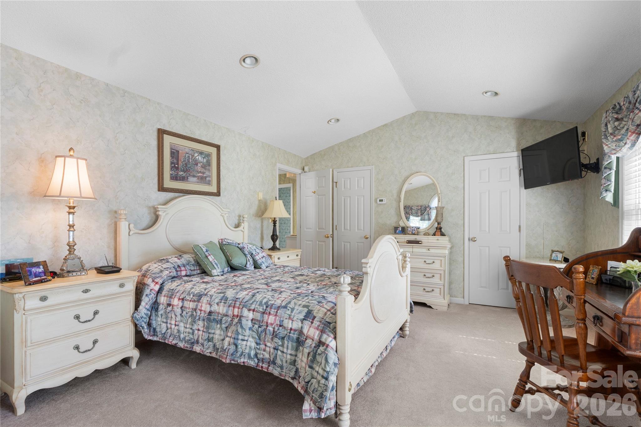 1687 Sexton Road, Unit 5 Denton, NC 27239 - Photo 24 of 48 a bedroom with a bed and a flat screen tv