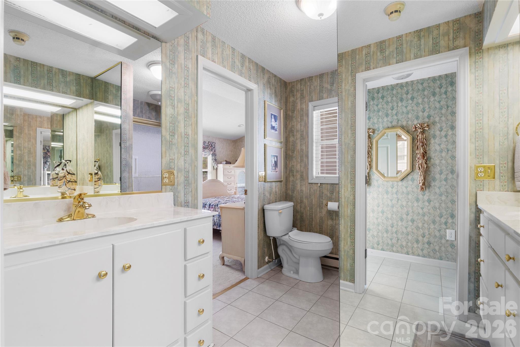 1687 Sexton Road, Unit 5 Denton, NC 27239 - Photo 27 of 48 a bathroom with a sink a toilet and a mirror