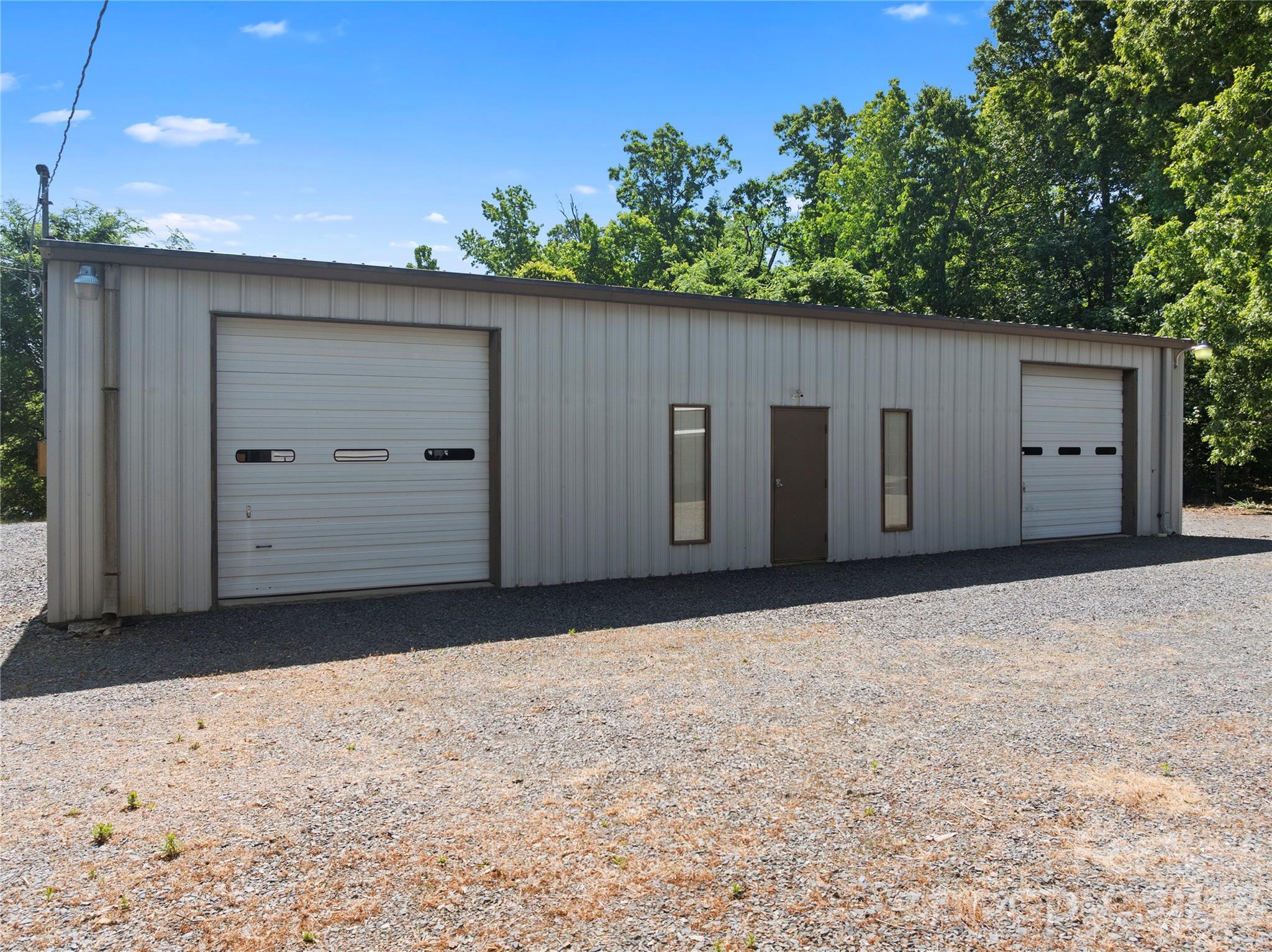 1687 Sexton Road, Unit 5 Denton, NC 27239 - Photo 30 of 48 a view of a backyard with garage