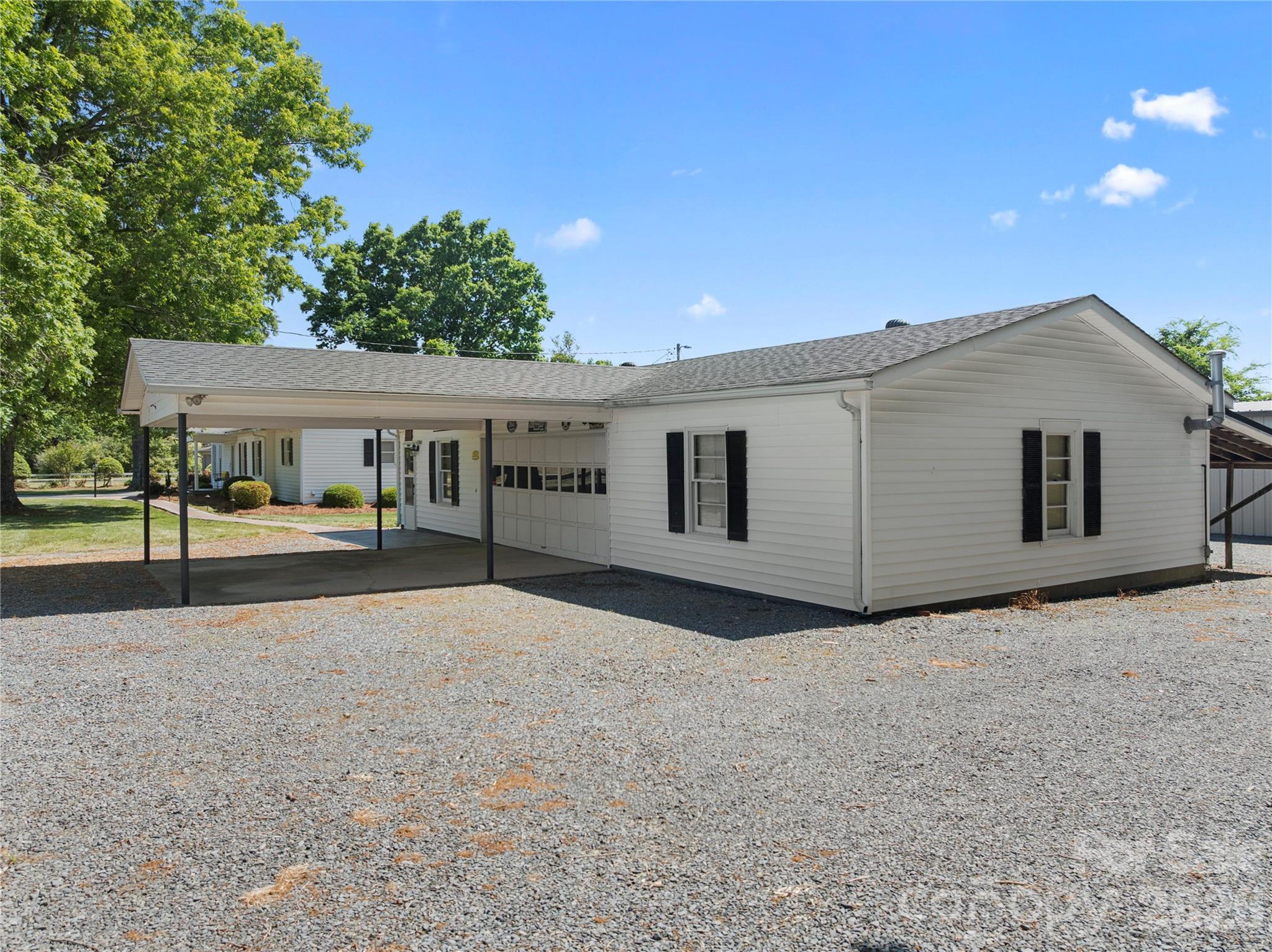 1687 Sexton Road, Unit 5 Denton, NC 27239 - Photo 34 of 48 a view of a house with a backyard