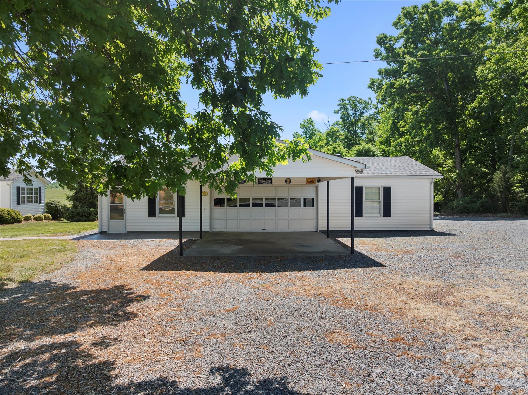1687 Sexton Road, Unit 5 Denton, NC 27239 - Photo 35 of 48 a view of a house with a yard and large tree