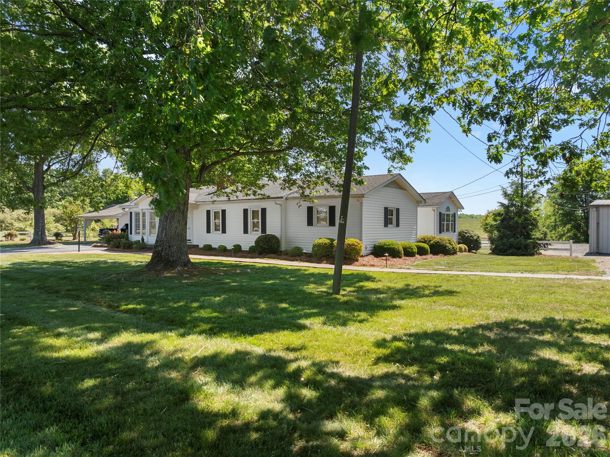1687 Sexton Road, Unit 5 Denton, NC 27239 - Photo 37 of 48 a front view of a house with a garden