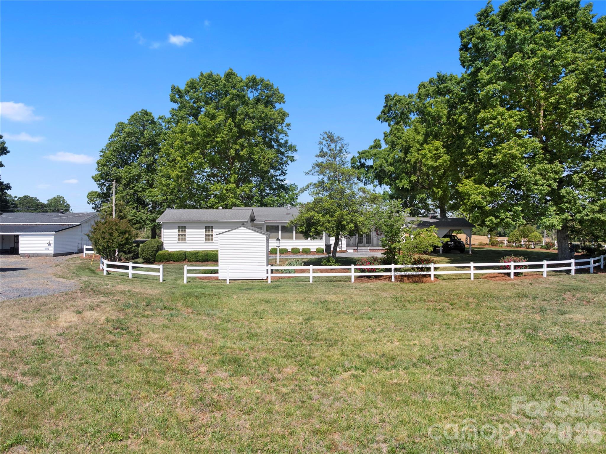1687 Sexton Road, Unit 5 Denton, NC 27239 - Photo 43 of 48 a swimming pool with lots of tress in front of it