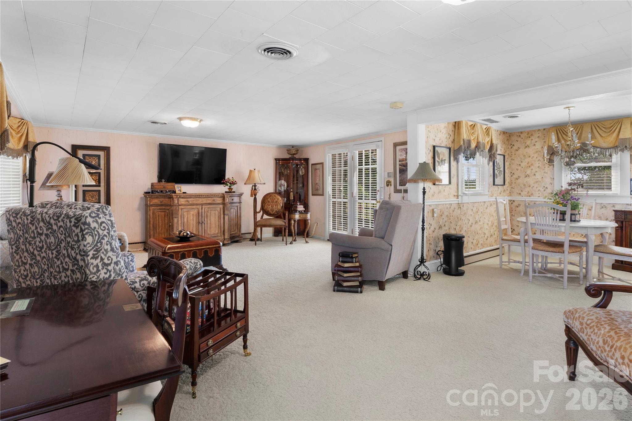 1687 Sexton Road, Unit 5 Denton, NC 27239 - Photo 8 of 48 a living room with furniture and a flat screen tv