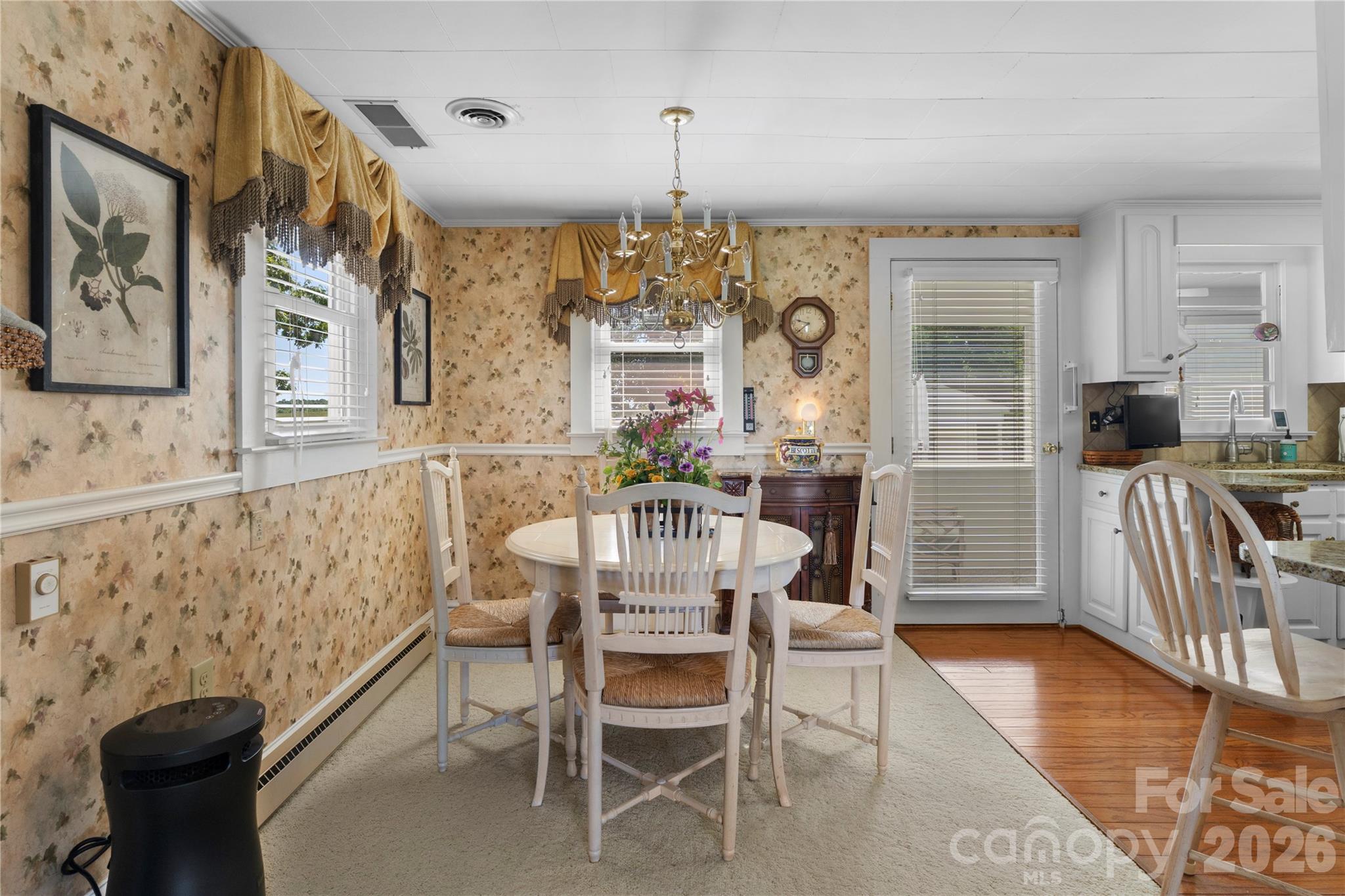 1687 Sexton Road, Unit 5 Denton, NC 27239 - Photo 10 of 48 a dining room with wooden floor and large windows