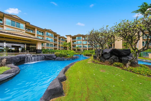 an aerial view of a house with yard swimming pool and outdoor seating